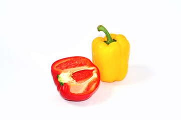 Red, yellow, sweet bell peppers placed on a white background.