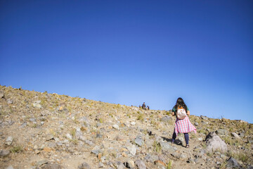 female climber looking at her partner from a distance, focus from a distance