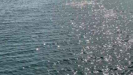 Wall Mural - silver sea water background at evening. glittering ocean waters. beautiful shiny seascape. romantic 
