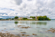 Saint-Cado In Brittany, Beautiful Houses In The Village, On A Small Island, With The Chapel In Background
