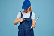© SHOTPRIME STUDIO - woman in construction uniform blue service professional cap