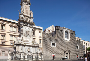 Wall Mural - Naples, Italy, the peculiar Chiesa del Gesù Nuovo with Obelisk of the Immaculate Conception, in the foreground