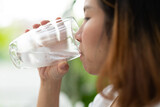 Fototapeta Łazienka - woman drinking fresh water, healthcare concept