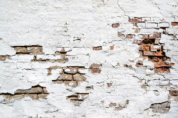 Wall Mural - weathered brick wall with crumbling white plaster for background use