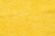 © tatomm - Clothing fabric yellow texture background, close up of cloth textile surface abstract.