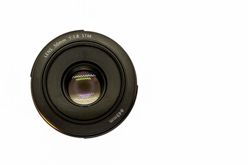 Top view of a 50mm professional optical lens for modern DSLR camera lens isolated on a white background. High resolution image. Copy paste text