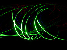Green Lines Of Light On A Black Background