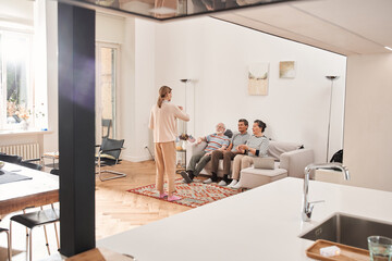 Wall Mural - Nurse standing at the room in front of her patients and playing with them