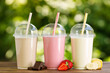 © alter_photo - set of different milkshakes in disposable plastic glasses