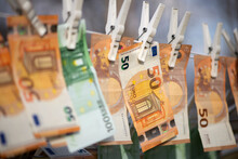 100 And 50 Euro Banknotes Drying. Washed Euro Paper Bills. Drying Euro On A String.Money Laundering