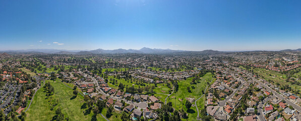 Wall Mural - Aerial view of residential neighborhood surrounded by golf and valley during sunny day in Rancho Bernardo, San Diego County, California. USA. 