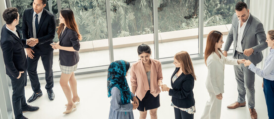 Wall Mural - Many business people gathering in modern office building for business conference in the city. Businessmen and businesswomen communication and human resources concept.