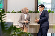 © NVB Stocker - Young business muslim woman and business man colleague talking and meeting discussing at the modern office