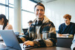 © Jacob Lund - Student sitting in classroom with laptop