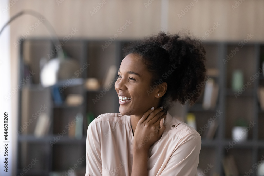 Head shot excited happy dreamy African American woman looking to aside, visualizing good future, overjoyed attractive young female dreaming about new opportunities, having fun, laughing at joke - obrazy, fototapety, plakaty 