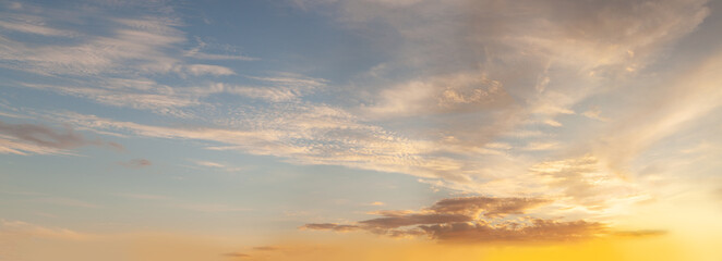 Wall Mural - sky background. sky with white cumulus and orange sunlight