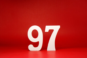 Ninety Seven ( 97 ) white number wooden on Red Background with Copy Space - New promotion 97% Percentage , Birthday anniversary , Business finance Concept 