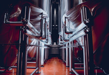 Rows Of Steel Tanks For Beer Fermentation And Maturation In A Craft Brewery