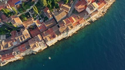 Wall Mural - Aerial view old buildings and old houses on the water's edge at Rovinj Adriatic Sea in Croatia at the sunset