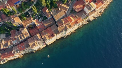 Poster - Aerial view old buildings and old houses on the water's edge at Rovinj Adriatic Sea in Croatia at the sunset