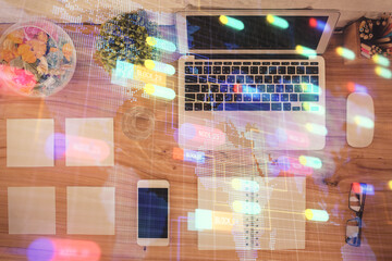multi exposure of data theme drawing hologram over topview work desk background with computer. conce