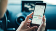 © Alex from the Rock - Woman using white mobile phone investing application in car. Stock market investment app in hand on the go. Close-up view