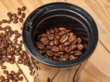 Electric Grinder With Covered Roasted Coffee Beans, Obtaining Ground Coffee For Making A Drink, Espresso And Cappuccino, Latte