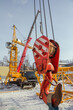 © Vasiliy Ulyanov - Construction crane assembly stage. Tower crane assembly. Installation of a construction crane before starting construction.