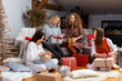 © ako-photography - young girls having fun wrapping gifts at home, great teamwork of friends packing presents for christmas