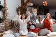 © ako-photography - young girls having fun wrapping gifts at home, great teamwork of friends packing presents for christmas