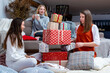 © ako-photography - young girls having fun wrapping gifts at home, great teamwork of friends packing presents for christmas
