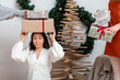 © ako-photography - young females having fun wrapping gifts at home, great teamwork of friends packing presents for christmas