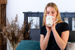 © ako-photography - young blonde female drinking tea in bed in the morning
