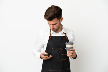 Restaurant caucasian waiter isolated on white background holding coffee to take away and a mobile