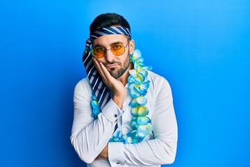 Canvas Print - Young hispanic businessman wearing party funny style with tie on head thinking looking tired and bored with depression problems with crossed arms.