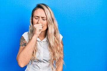 Poster - Beautiful young blonde woman wearing casual white shirt feeling unwell and coughing as symptom for cold or bronchitis. health care concept.