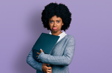 Canvas Print - Young african american woman working using computer laptop depressed and worry for distress, crying angry and afraid. sad expression.