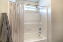 Bathroom Interior With Tub Shower Combo And Window