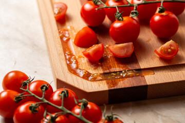 Sticker - Closeup of fresh cherry tomatoes on a wooden cutting board