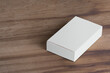 © Masoud Rezaeipoor/Wirestock - Blank white pillbox of suppositories loaf on a wooden surface - editable mockup template