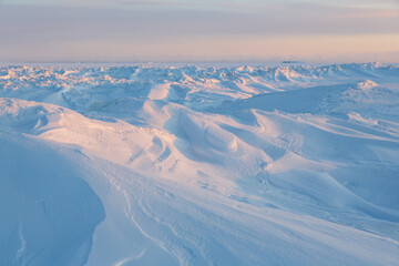 Wall Mural - winter arctic landscape. view of snow and ice at sunset. ice hummocks on the frozen sea in the arcti
