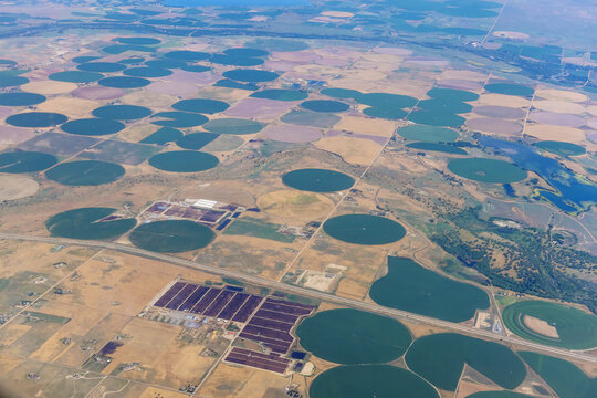 Arizona desert farmland from a airplane of agriculture circled fields