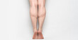 © Anciens - tiptoed people showing his strong gastrocnemius
