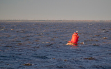 Sea battle of white and red sway on the waves.