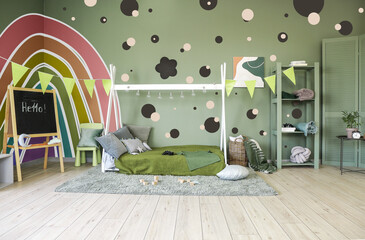 Interior of modern children's room with comfortable bed and beautiful painting on wall