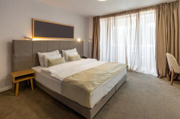 Interior of a luxury hotel double bed bedroom