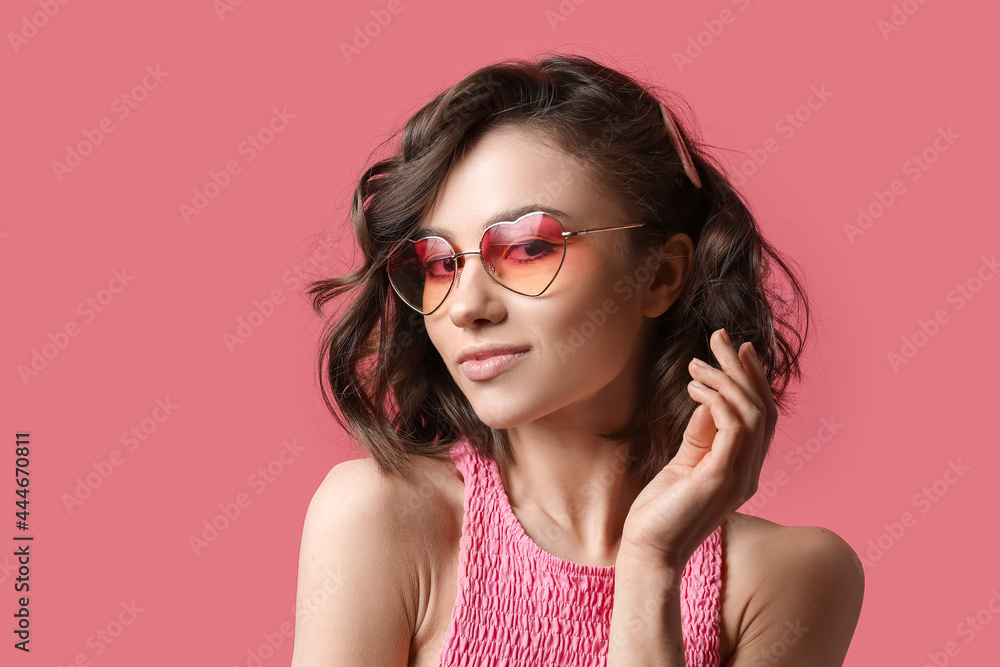 Beautiful young woman on color background