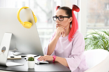 Wall Mural - Female programmer working with computer in office