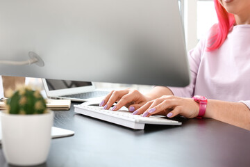 Wall Mural - Female programmer working with computer in office, closeup