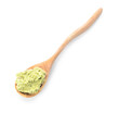 Spoon with tasty guacamole on white background